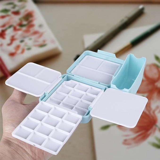 WTYONZEL Travel Pocket Watercolor Set, Artist Outdoor Sketch Kits with 24 Well Palette,3 Foldable Palettes,Clip-on Washing Bucket,Silicone Bag,Ideal for Outdoor Sketch Artists(Blue)