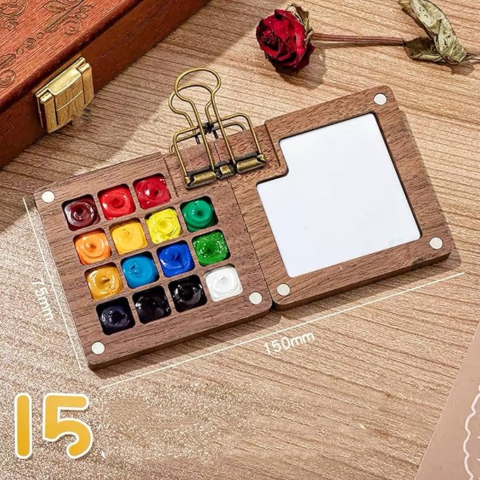 Mini Watercolor Paint Set, Mini Watercolor Travel Set with 1 Wooden 15-Grid Palette, 24 Colors Paint, 1 Sketch Books and 1 Brushes, Copper Clip and Sketchbook for Travel Painting