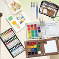Mini Watercolor Travel Paint Set, Acrylic Painting Palette and Wooden Paint Box(15 Grids), 2 Sketchbooks, 2 Brush Pens and 24 Color Paints. Perfect for Artists, Students and Painters on The Go